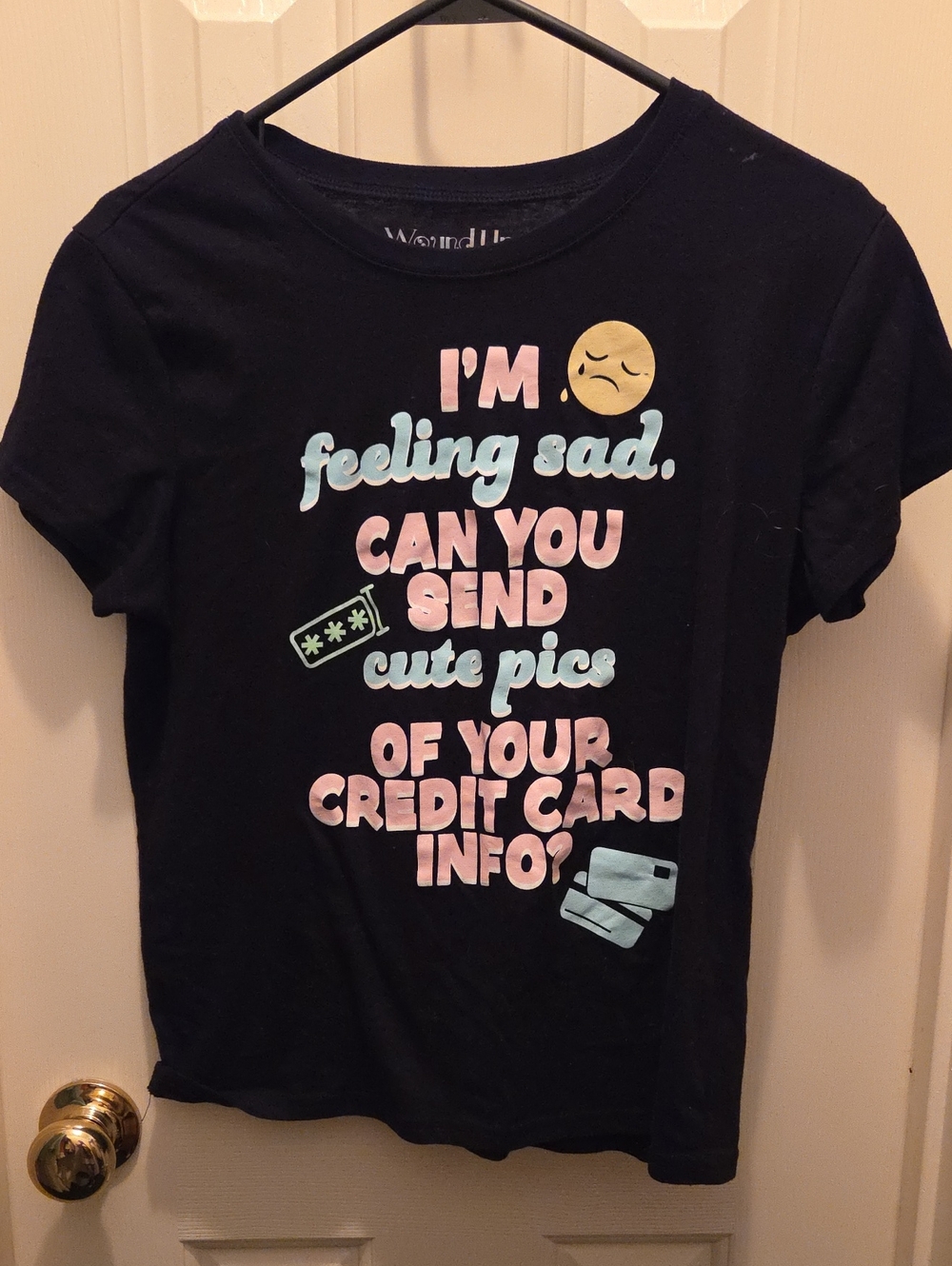 Wound Up Black Tee with Pastel Pink, Light Blue & Yellow Graphic